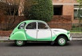 Vintage green and white Citroen 2Cv at the roadside