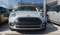 Front view of the gray new electric Mini Cooper on display outside the official dealership