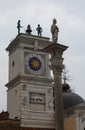 Udine, UD, Italy - December 27, 2023: Clock Tower and statues in the main square Royalty Free Stock Photo