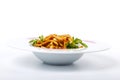 Udon with chicken: Udon Noodles, chicken fillet, zucchini, paprika, carrots, sesame. Plate on a white background. Royalty Free Stock Photo