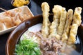 A bowl of udon - a Japanese noodle usually served with beef and fried burdock. Royalty Free Stock Photo