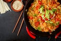 Udon pasta with shrimp, tomatoes and paprika.