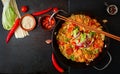 Udon pasta with shrimp, tomatoes and paprika.