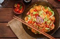 Udon pasta with shrimp, tomatoes and paprika.