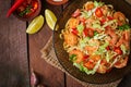 Udon pasta with shrimp, tomatoes and paprika.