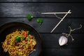 Udon stir fry noodles with meat or chicken. Served with chopsticks. Top view. Royalty Free Stock Photo