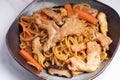 Udon stir fry noodles teriyaki sauce with pork meat and vegetables shiitake mushrooms Royalty Free Stock Photo