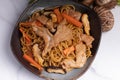 Udon stir fry noodles teriyaki sauce with pork meat and vegetables shiitake mushrooms Royalty Free Stock Photo