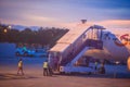 Thai Smile airline parking at the terminal during sunset at Udon Thani International Airport (UTH) in the northeast region of Thai