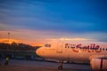 Thai Smile airline parking at the terminal during sunset at Udon Thani International Airport (UTH) in the northeast region of Thai