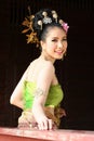 One woman in THAI RETRO DRESS is posing for a photograph.