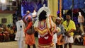 An artist dancing with god ornaments for hindu religious performance