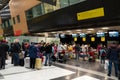 Ufa, Russia april 2, 2020: Passengers arrive at check-in counters at UFA Airport in Russia. Crowds of travelers in queue at