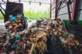 Ufa, Russia, 1 July, 2019: unloading truck in a mountain of trash.
