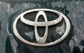 UFA, RUSSIA - 23 June 2019: closeup Toyota logo on dirty dark green Land Cruiser Prado car