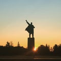 UFA, RUSSIA - 1 june 2016: Sculpture of Vladimir Ilyich Lenin in the town square against the sky and sunset beam. Concept for