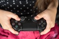 Hand girl playing Sony Dualshock 4 Royalty Free Stock Photo