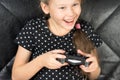 Hand girl playing Sony Dualshock 4 Royalty Free Stock Photo