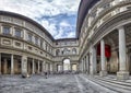 Uffizi Gallery in Florence under a blue sky with clouds, panorama