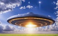 UFO an alien plate hovering over the field hovering motionless in the air Unidentified flying object, alien invasion Royalty Free Stock Photo