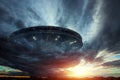 UFO, an alien plate soars in the sky, hovering motionless in the air. Unidentified flying object, alien invasion, extraterrestrial Royalty Free Stock Photo