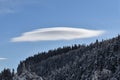 UFO cloud over the frozen forest Royalty Free Stock Photo