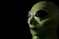 UFO and extraterrestrial life encounter of third degree concept theme with close up on the face of a green alien with high Royalty Free Stock Photo