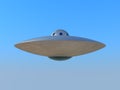 UFO flying in blue sky Royalty Free Stock Photo