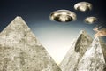 Ufo flying over pyramids Royalty Free Stock Photo