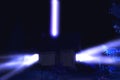 UFO illuminating country house with blue beam