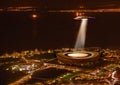 UFO, light and city in night, alien invasion and search with light on stadium in Cape Town. UAP ship, flying saucer and