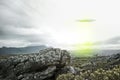 UFO, sky and spaceship with lights over mountain for extraterrestrial, surreal or alien invasion. Spacecraft, war or Royalty Free Stock Photo