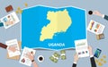 Uganda africa economy country growth nation team discuss with fold maps view from top