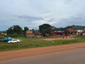 ypical roadside rural village lifestyle in Uganda, with children playing