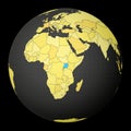 Uganda on dark globe with yellow world map.