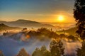 Uganda sunrise with trees, hills, shadows and morning fog Royalty Free Stock Photo