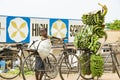 Boy with heavy load on his bike in Uganda. Boy carrying loads on bike. Bicycles loaded with plantains, cooking bananas and bags