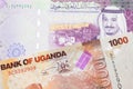 Ugandan currency paired with money from Saudi Arabia