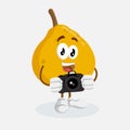 Ugli Fruit mascot and background with camera pose Royalty Free Stock Photo