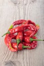 Ugly Chili pepper on a gray wooden background. Selective focus