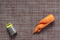 Ugly deformed twisted carrot on a brown wicker rustic background, ugly food, zero waste concept, top view, copy space