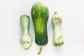 Ugly food concept. Unusual shaped zucchini with mold, scar-like structure, scratches. Top view