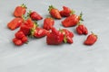 Ugly fruits. Abnormal strawberry shape. Ripe berries on a gray background. Selective focus, copy space