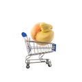 Ugly fruits concept. Deformed peach in trolley (shopping cart) on white background. Design element. Royalty Free Stock Photo
