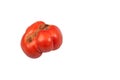 Ugly funny ripe tomato on a white isolated background. Copy space Royalty Free Stock Photo