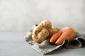 Ugly organic carrot and potatoes. Space for text. Concept organic vegetables