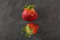 Ugly organic strawberries on white background