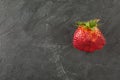 Ugly organic strawberries on white background
