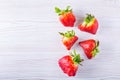 Ugly organic strawberries isolated on white background