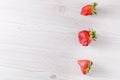 Ugly organic strawberries isolated on white background